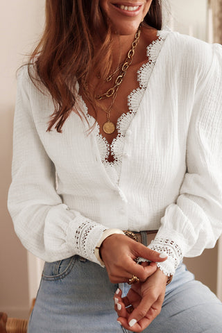 This is a crisp white cotton blouse with a crepe-like texture and crochet embroidered sleeves for that dainty look. Pairs well with a refreshing drink, layering necklaces, tousled hair, and big dreams.