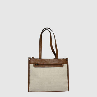 Tote bag with brown leather accents on a light gray background