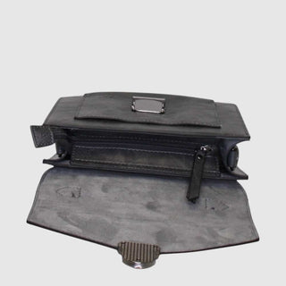 Black metal bracket or component on a light gray background