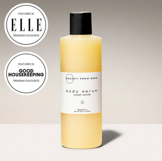 Body serum bottle with 'Beauty from Bees' branding and certification badges on a neutral background
